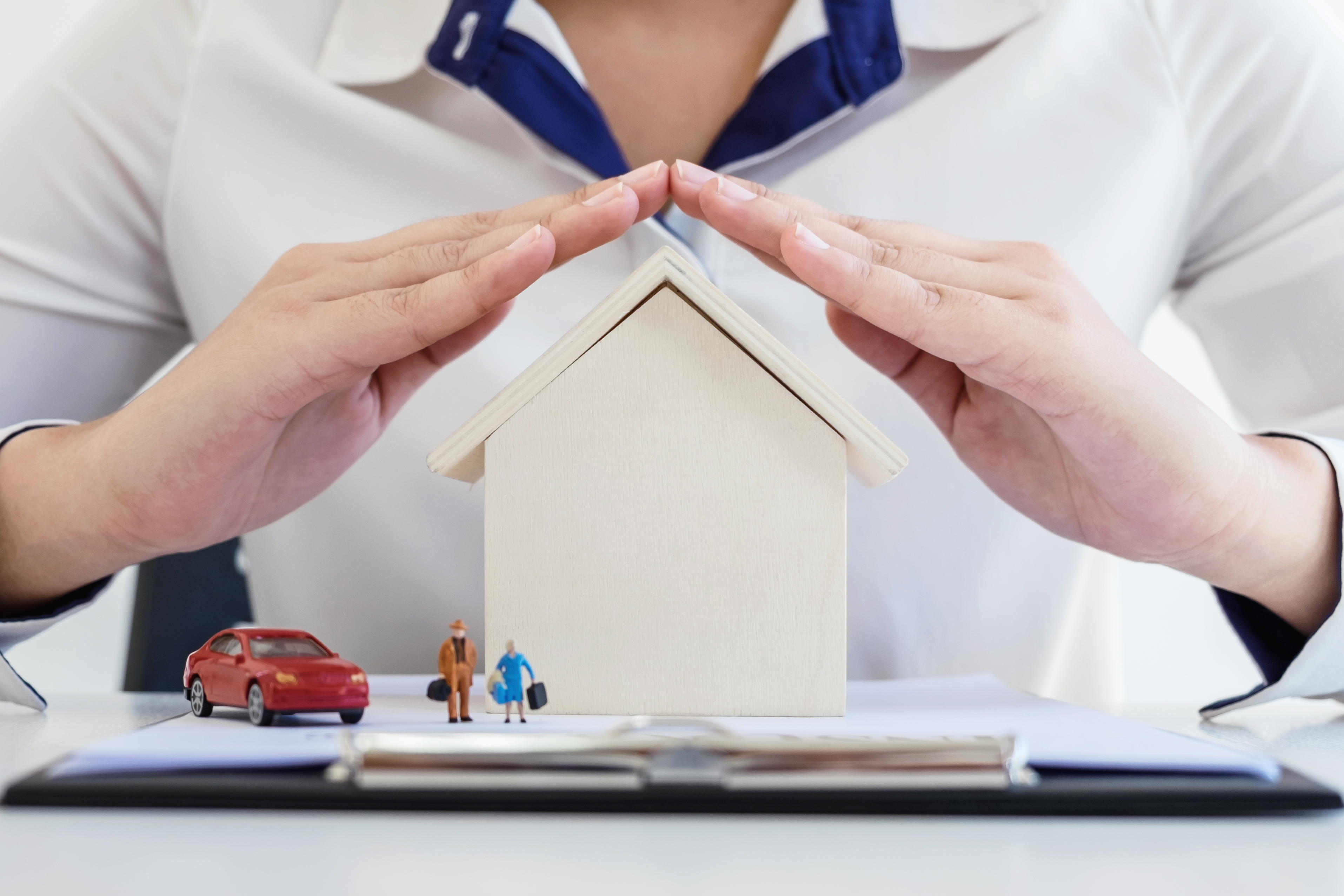Insurance And Care Protection Of House Family Concept, Woman With Protective Gesture Of Small Home, People And Car Model